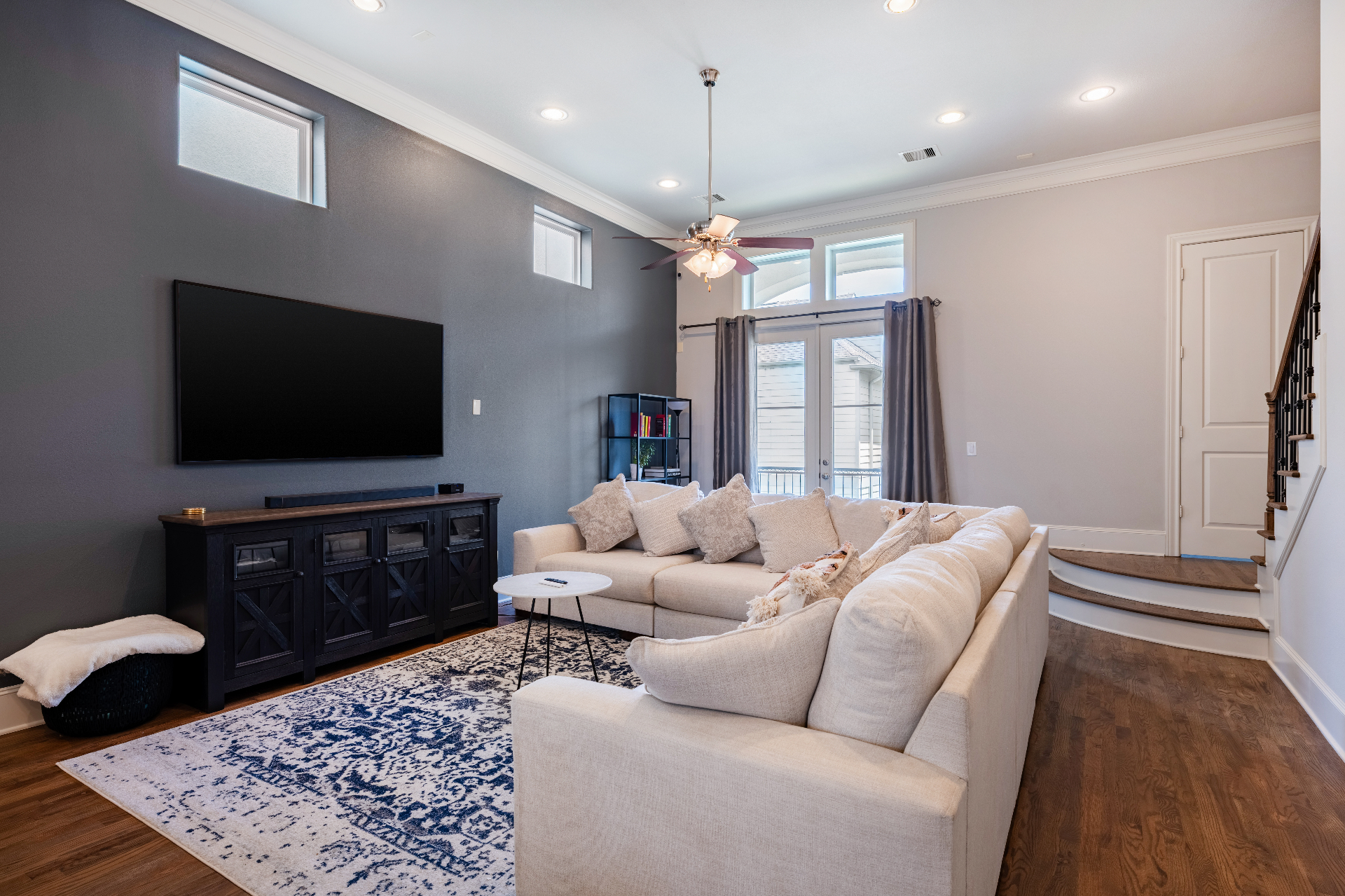 The Heights private home — living room with leather sofas and curated art
